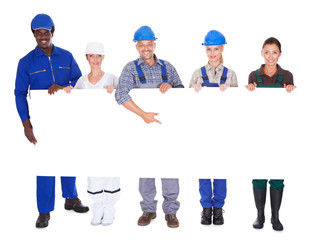 People With Diverse Professions Holding Placard