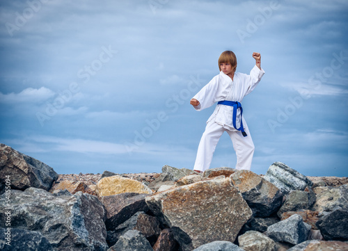 Fotoboard na płycie Młody chłopak trenuje karate