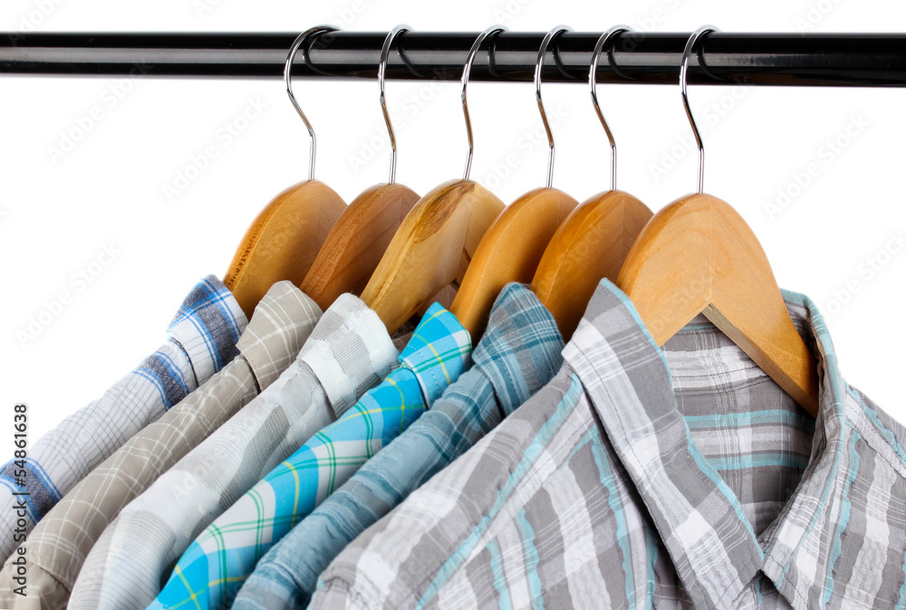 Shirts with ties on wooden hangers isolated on white