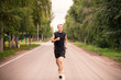 © len44ik - Sportive young man jogging outdoor