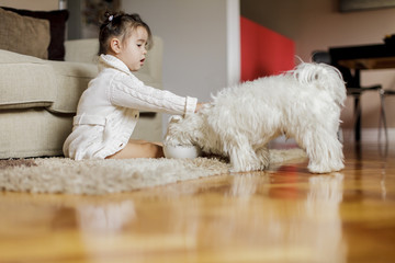 Canvas Print - Little girl with a dog