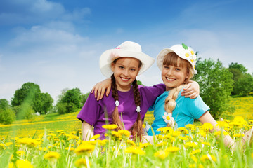 Beautiful girls in dandelion fields