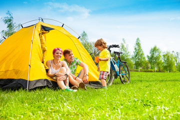 yong couple with kid in a tent