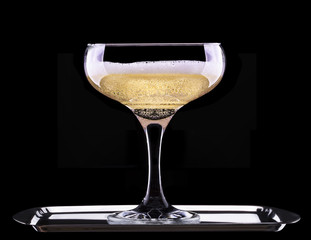 glass of champagne isolated on black background