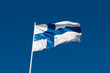 Flag of Finland before blue sky.