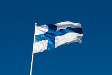 Flag Of Finland Before Blue Sky.