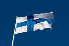 Flag Of Finland Before Blue Sky.