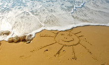 Drawing Of The Smiling Sun On Sand