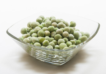 Wall Mural - frozen peas close up in white background