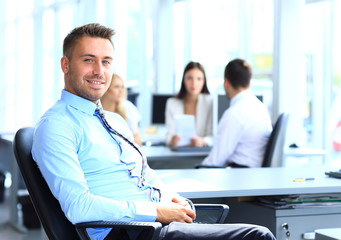 Wall Mural - Portrait of young businessman in office