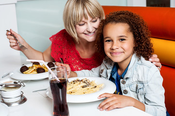 Mother and daughter in a restaurant