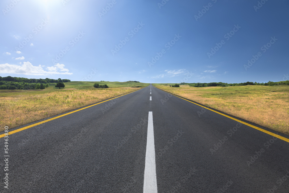 Driving on an empty road at bright sunny day - obrazy, fototapety, plakaty 