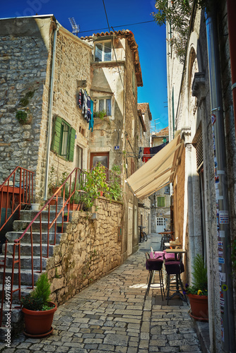 Obraz w ramie Traditional old street of Croatia with cafe