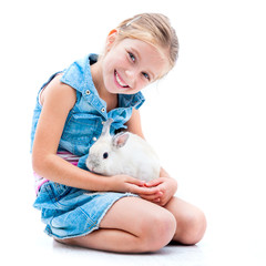 cute little girl a white rabbit