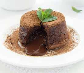 Wall Mural - Chocolate dessert fondant with a liquid center and strawberries.