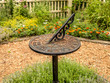 © cvmcgarry - Garden sundial with blurred background