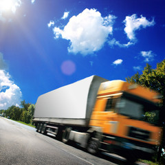 Canvas Print - yellow truck on the asphalt road