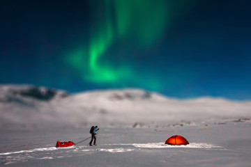 winter camping in sweden with northern lights