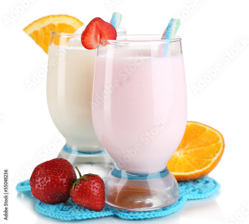 Fototapeta na wymiar Delicious milk shakes with orange and strawberries isolated
