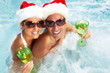 © grinny - Happy Christmas santa couple in jacuzzi.