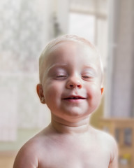 Portrait of cheerful  baby boy(1 year).