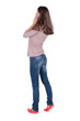 © ghoststone - Back view of shocked woman in blue jeans. upset young brunete gi