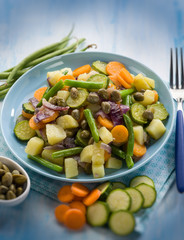 Canvas Print - steamed mixed vegetables with capers, selective focus