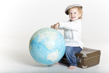 Happy Young Traveler Holding The World