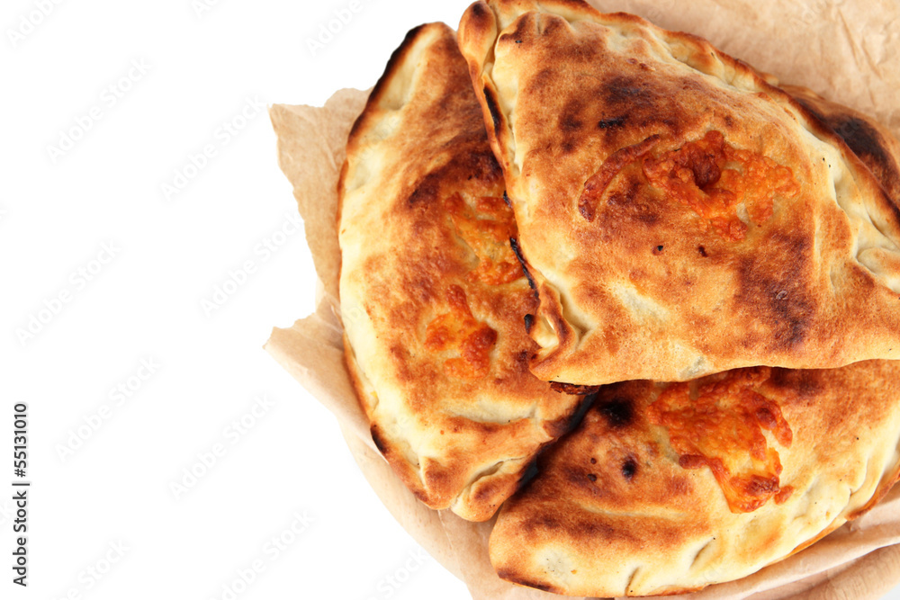 Pizza calzones on tracing paper isolated on white