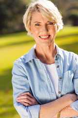 Wall Mural - middle aged woman with arms crossed