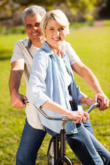 Wall Mural - senior couple on a bicycle outdoors