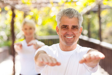 Wall Mural - middle aged man and woman workout