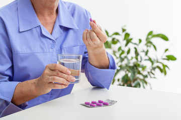 Wall Mural - Woman taking pills