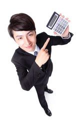 Poster - Attractive business man pointing a calculator