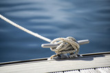 Detail image of yacht rope cleat on sailboat deck