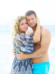 couple in love hugging on the beach