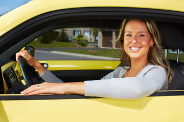 Canvas Print - Young woman car driver.