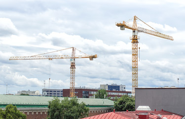 Two working cranes in the city