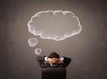 Businessman Sitting With Cloud Thought Above His Head