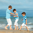 © rimmdream - Three brothers are  play on beach