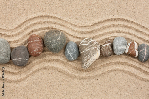 Naklejka na szybę Striped stones on the sand