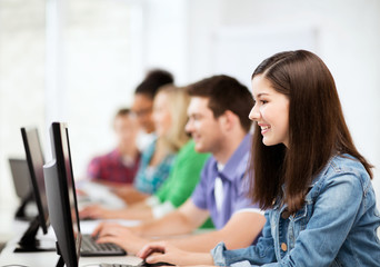 Wall Mural - students with computers studying at school