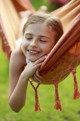 Wall Mural - Rest in the garden - lovely girl in hammock