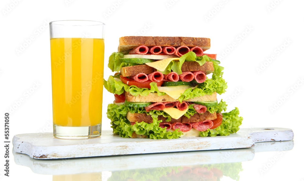 Huge sandwich on wooden board, isolated on white