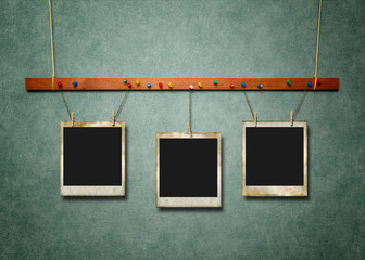 Wall Mural - Photo Frames on green textured background.