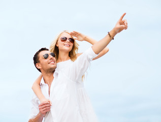 Canvas Print - couple in shades at sea side