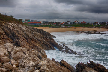 Wall Mural - coast with waves breaking on a stormy day