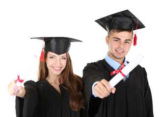 Two happy graduating students isolated on white