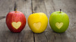 Leinwandbild Motiv Apples with engraved hearts
