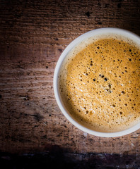 Poster - Closeup cup of espresso on old wooden table over grunge backgrou